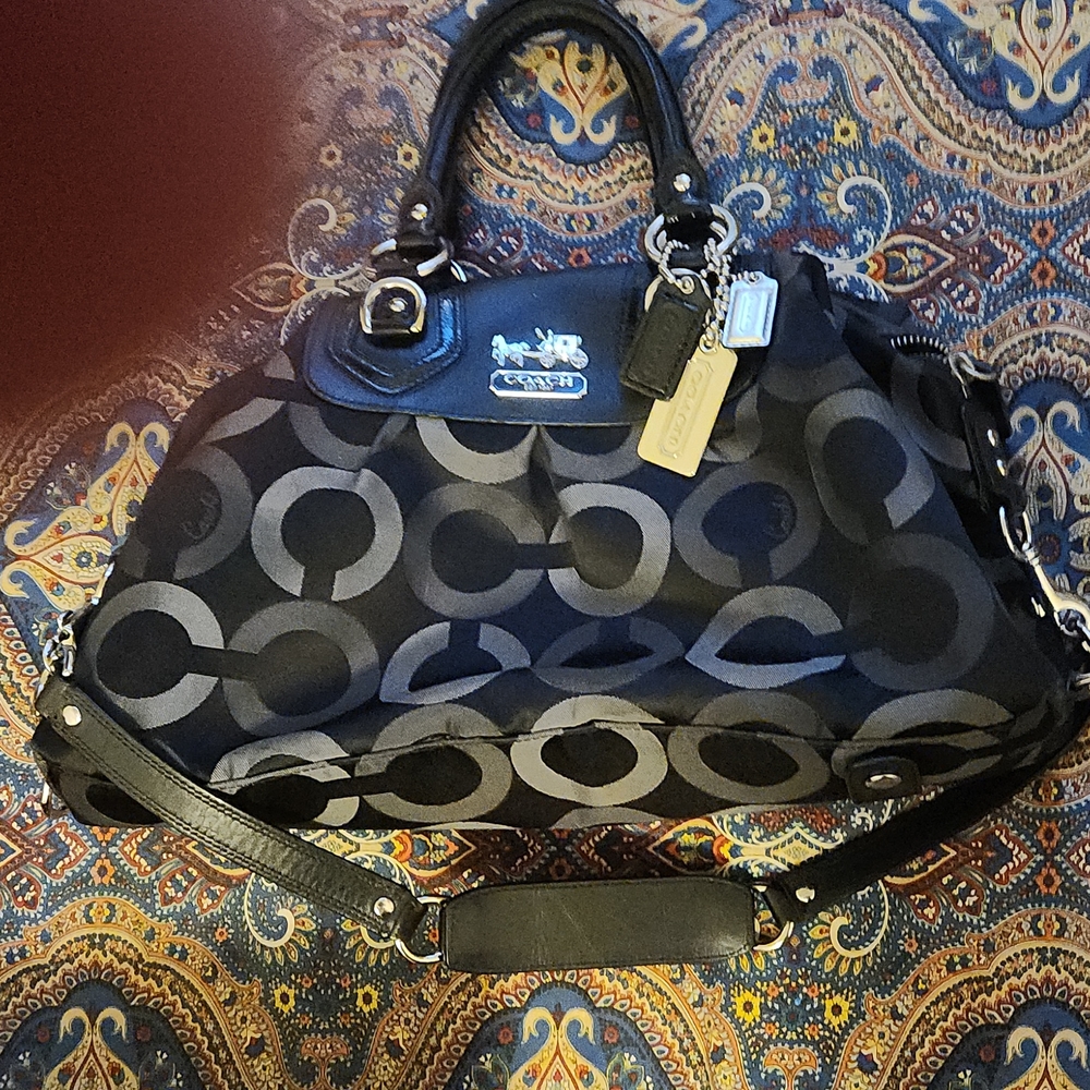 Black and grey Coack purse with silver hardware.